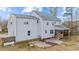 Rear exterior view showcasing a screened porch and garden beds, blending indoor and outdoor living at 415 Moonlight Dr, Fuquay Varina, NC 27526