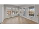 Sunroom featuring tile flooring and plenty of natural light through multiple windows at 415 Moonlight Dr, Fuquay Varina, NC 27526