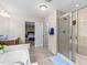 Bright bathroom featuring a glass shower and soaking tub at 428 Morgan Ridge Rd, Holly Springs, NC 27540