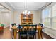 Bright dining area featuring coffered ceiling and light fixture at 428 Morgan Ridge Rd, Holly Springs, NC 27540