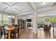 Open concept dining room, with hardwood floors, and adjacent living room with a fireplace at 428 Morgan Ridge Rd, Holly Springs, NC 27540