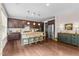 Modern kitchen featuring dark wood cabinets, granite countertops, and stainless steel appliances at 428 Morgan Ridge Rd, Holly Springs, NC 27540