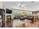 Spacious living room with fireplace, large sectional sofa, and abundant natural light at 428 Morgan Ridge Rd, Holly Springs, NC 27540