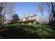 Spacious backyard features a well-maintained lawn, mature trees, and multi-level deck perfect for outdoor enjoyment at 4332 Blossom Hill Ct, Raleigh, NC 27613