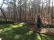 Backyard with mature trees and lush green lawn at 4332 Blossom Hill Ct, Raleigh, NC 27613