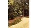 Spacious backyard with lush trees and landscaping, a perfect outdoor retreat at 4332 Blossom Hill Ct, Raleigh, NC 27613