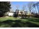 Expansive backyard with a large wooden deck, ideal for outdoor entertaining at 4332 Blossom Hill Ct, Raleigh, NC 27613