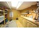 Spacious basement workshop with pegboard and cabinets is lit by fluorescent lights at 4332 Blossom Hill Ct, Raleigh, NC 27613