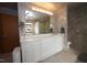 Spacious bathroom with double vanity, glass shower, tiled floors, and ample storage space at 4332 Blossom Hill Ct, Raleigh, NC 27613