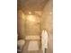 Tiled walk-in shower with glass door and a plush towel hanging nearby at 4332 Blossom Hill Ct, Raleigh, NC 27613