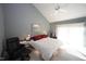 Bright bedroom with vaulted ceiling, large windows, and a comfortable seating area at 4332 Blossom Hill Ct, Raleigh, NC 27613