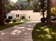 Beautiful single-story home featuring mature trees and a large driveway leading to the attached garage at 4332 Blossom Hill Ct, Raleigh, NC 27613
