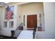 Close up of the front door with painted white steps and an American flag at 4332 Blossom Hill Ct, Raleigh, NC 27613