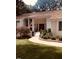 Inviting single-story home with a classic facade, well-manicured lawn, and charming American flag at 4332 Blossom Hill Ct, Raleigh, NC 27613