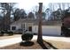 Charming single-story home with an attached garage, manicured lawn, and mature trees at 4332 Blossom Hill Ct, Raleigh, NC 27613
