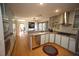 Spacious kitchen featuring stainless steel appliances, ample counter space, and hardwood floors at 4332 Blossom Hill Ct, Raleigh, NC 27613