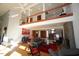 Bright open-concept living area with hardwood floors, stone fireplace, and soaring ceilings at 4332 Blossom Hill Ct, Raleigh, NC 27613