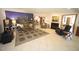 Open-concept living room with a fireplace, a city mural and neutral decor with access to other areas at 4332 Blossom Hill Ct, Raleigh, NC 27613