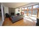 Comfortable living room with hardwood floors, a stone fireplace, and views of the backyard at 4332 Blossom Hill Ct, Raleigh, NC 27613