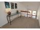 View of staircase with a glass topped table, wall art, and natural light at 4332 Blossom Hill Ct, Raleigh, NC 27613