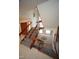 Carpeted staircase with wood and metal railings at 4332 Blossom Hill Ct, Raleigh, NC 27613
