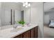 Bathroom featuring double vanity sinks and wood cabinets at 4711 Marena Pl, Durham, NC 27707