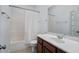 Well-maintained bathroom features a tub with shower and vanity with generous counter space at 4711 Marena Pl, Durham, NC 27707