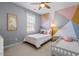 Charming bedroom featuring a bed and unique geometric wall art at 4711 Marena Pl, Durham, NC 27707
