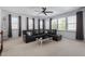 Well-lit bonus room features a large leather sectional and neutral carpet at 4711 Marena Pl, Durham, NC 27707