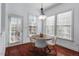 Bright breakfast nook with a round table, four chairs, and lots of natural light at 4711 Marena Pl, Durham, NC 27707