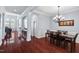 Formal dining area with dark wood floors and elegant chandelier at 4711 Marena Pl, Durham, NC 27707