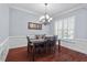 Dining area with hardwood floors, chandelier and natural light at 4711 Marena Pl, Durham, NC 27707