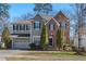 Charming home featuring a combination of brick and gray siding at 4711 Marena Pl, Durham, NC 27707