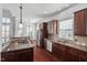 Spacious kitchen with stainless steel appliances, granite countertops, and a breakfast area at 4711 Marena Pl, Durham, NC 27707