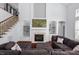 Comfortable living room with fireplace and built-in shelving at 4711 Marena Pl, Durham, NC 27707