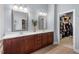 Bathroom with double sinks, vanity with lots of drawer space, and a walk in closet at 4711 Marena Pl, Durham, NC 27707