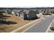 Rear aerial view of the home in a neighborhood with grassy areas in the yards at 5 Misty Grove Trl, Franklinton, NC 27525