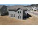 Aerial view of the back of the home with a grassy area and view of the street at 5 Misty Grove Trl, Franklinton, NC 27525