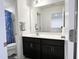 Well-lit bathroom with a modern vanity, mirror, and plenty of space at 5 Misty Grove Trl, Franklinton, NC 27525