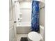 Clean bathroom featuring a bathtub/shower with a fun, shark-themed shower curtain at 5 Misty Grove Trl, Franklinton, NC 27525