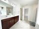 A view into the primary bathroom with double sink vanity, soaking tub and glass shower at 5 Misty Grove Trl, Franklinton, NC 27525