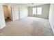 Bright bedroom featuring a window and neutral walls, creating a serene and inviting atmosphere at 5 Misty Grove Trl, Franklinton, NC 27525