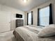 Bedroom with neutral colors, a TV, and a dresser providing ample storage at 5 Misty Grove Trl, Franklinton, NC 27525