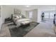 Bedroom suite featuring a large bed and windows for plenty of natural light at 5 Misty Grove Trl, Franklinton, NC 27525