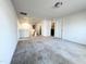Spacious bonus room with neutral carpet, white walls, and ample natural light at 5 Misty Grove Trl, Franklinton, NC 27525