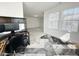 Home office space with natural light, a modern rug, and contemporary desk at 5 Misty Grove Trl, Franklinton, NC 27525