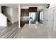 Bright kitchen showcasing a large island with countertop and modern dark cabinets at 5 Misty Grove Trl, Franklinton, NC 27525