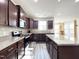 Modern kitchen with island, stainless steel appliances, and stylish backsplash at 5 Misty Grove Trl, Franklinton, NC 27525