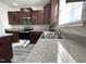 Close-up of kitchen countertop, stainless sink, faucet, and cabinets at 5 Misty Grove Trl, Franklinton, NC 27525
