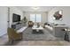 Stylish living room with modern furniture, cozy textures and plenty of room for entertaining at 5 Misty Grove Trl, Franklinton, NC 27525